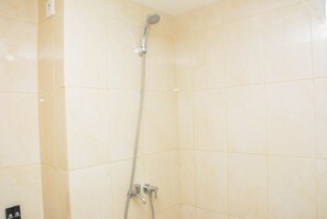 Room | Bathroom | Shower, free toiletries, towels - Cozy Stay Studio at Springlake Summarecon Apartment (Bekasi)