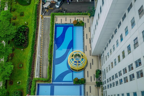 Outdoor pool - Homey and Cozy Studio Room at Bassura City Apartment (Jakarta)