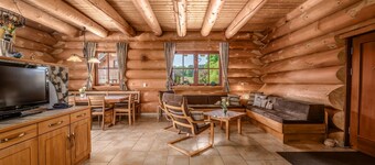 Natural log house Morgensonne - Heumann's log houses by the forest