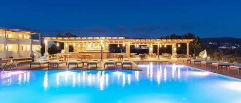 Seasonal outdoor pool, open 9:00 AM to 8:00 PM, pool umbrellas