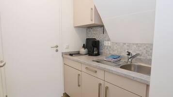 Fridge, coffee/tea maker, electric kettle, toaster