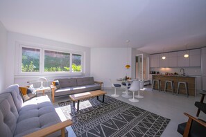 Family Apartment, 1 Bedroom, Lakeside (Coloratura) | Living room | 21-inch flat-screen TV with digital channels, TV