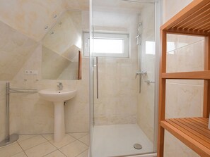 Shower, hair dryer, towels, toilet paper