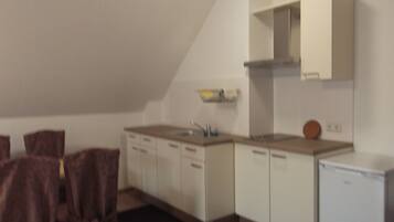 Fridge, stovetop, electric kettle, cookware/dishes/utensils