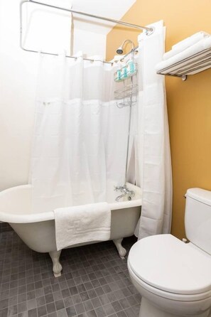 Bathtub, hair dryer, towels
