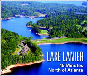 A scenic view of Lake Lanier with surrounding greenery and golf courses. - ❤️GREAT FOR FAMILIES❤️ (Lawrenceville)