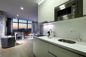 Family Room | Private kitchenette | Microwave, stovetop, electric kettle, dining tables - Domo Casablanca (Casablanca)