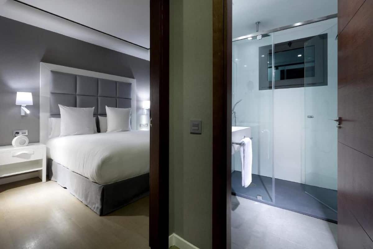 family room | premium bedding, minibar, in-room safe, individually decorated