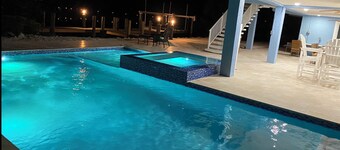 Large outdoor space with pool/hot tub, on 200ft wide canal- quick ride to Ocean!