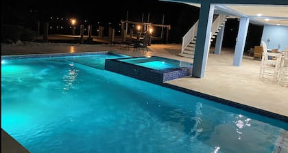 Large outdoor space with pool/hot tub, on 200ft wide canal- quick ride to Ocean!