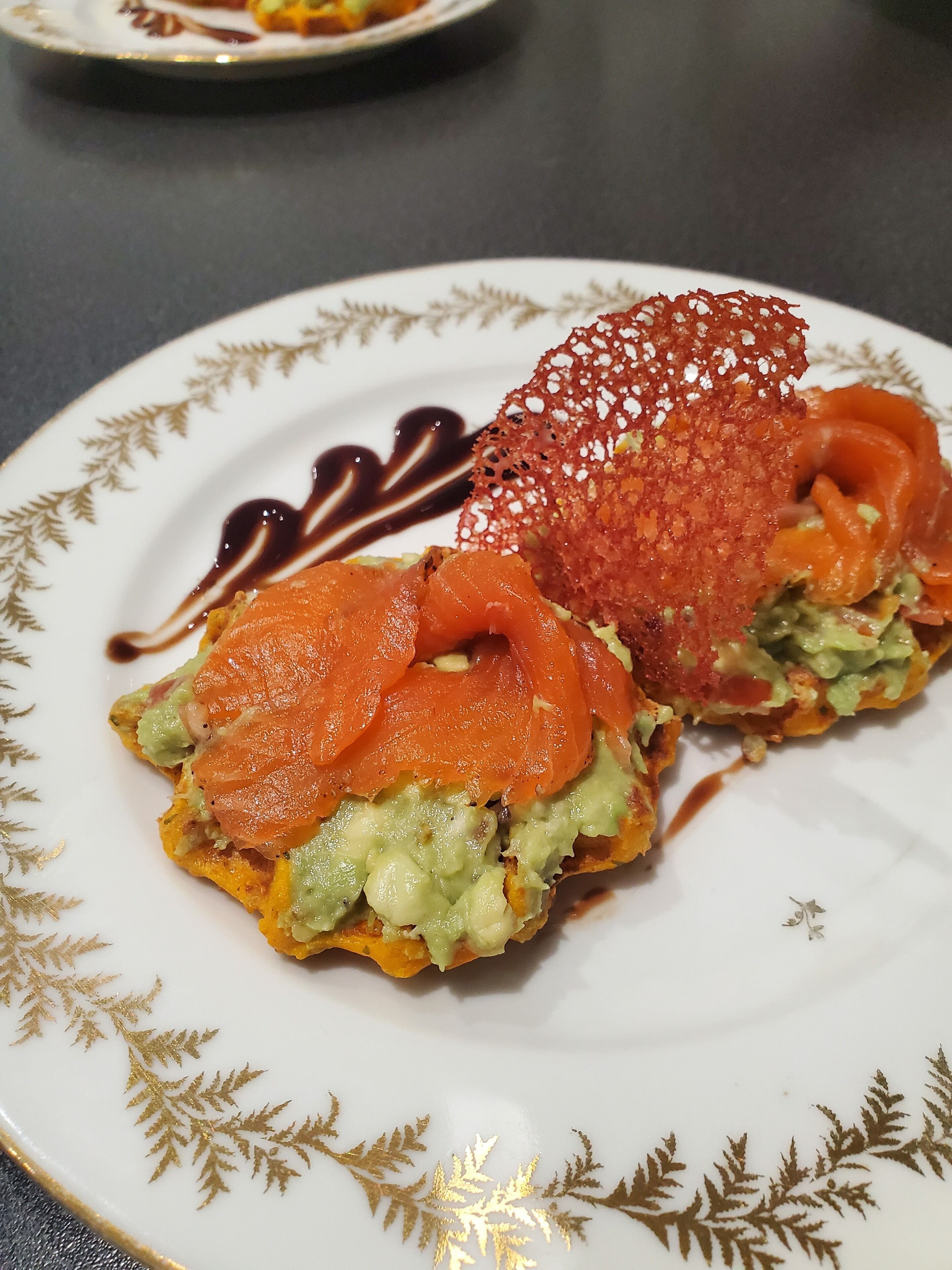 A plate with a sandwich and a decorative item.