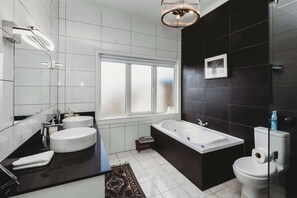 Bathtub, hair dryer, towels, soap