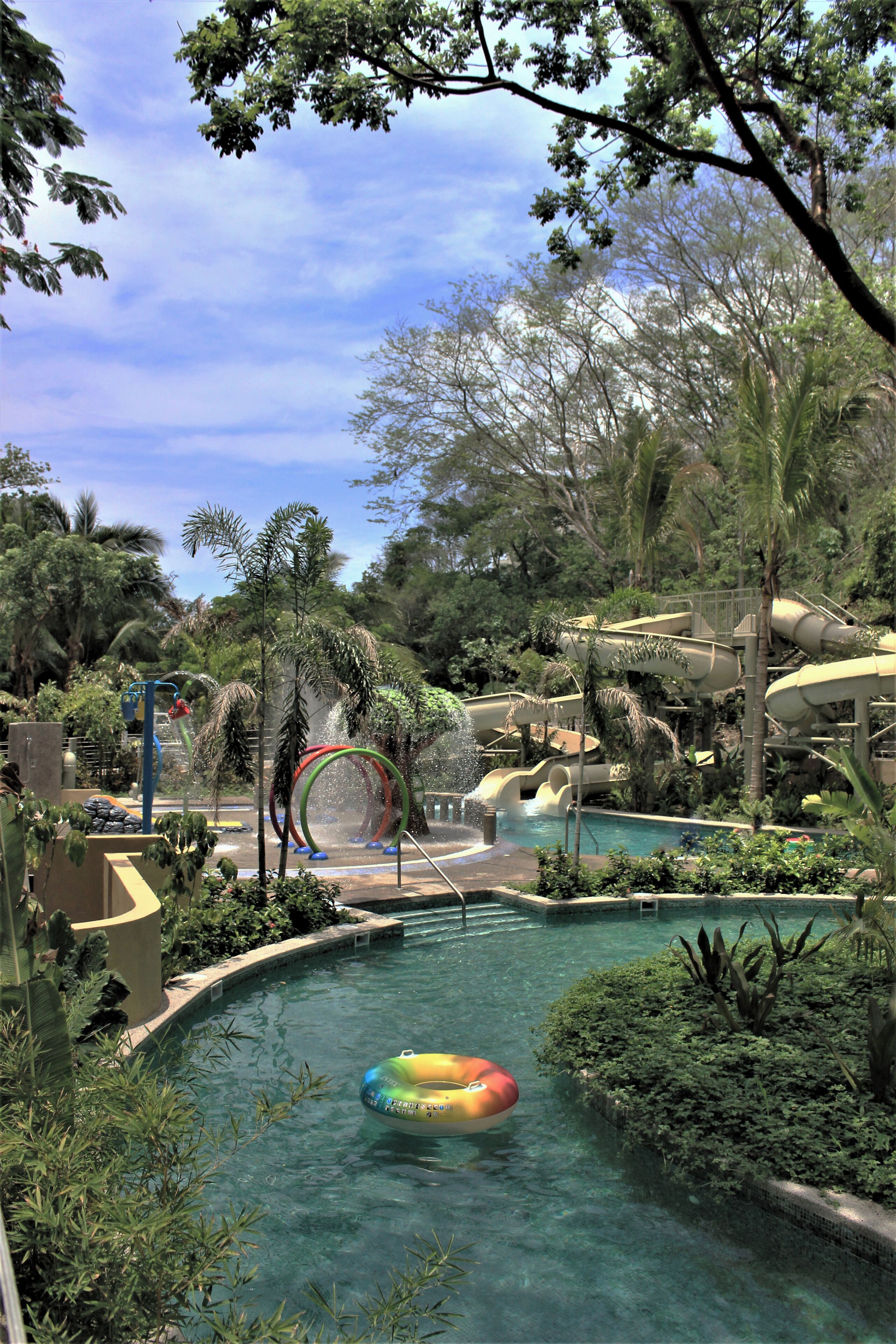 A water park with slides, a pool, and a ring water feature.