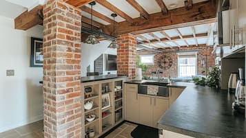 Fridge, microwave, stovetop, coffee/tea maker