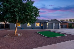 Exterior - Resort Style Backyard- Heated Pool, Putting Green, Outdoor TV and Pool Table. (Peoria)
