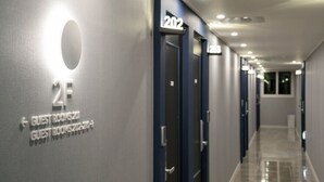 A hotel corridor with doors labeled 202 and 203, indicating guest rooms. - Hotel Yaja Gwangalli (Busan)