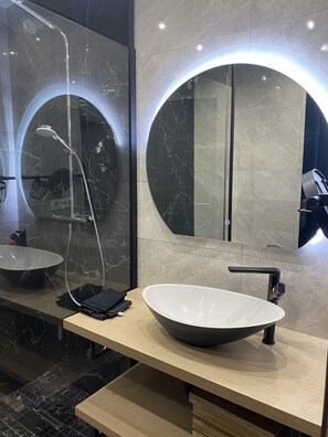 Shower, hair dryer, towels, toilet paper