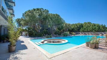 Outdoor pool, open 9:00 AM to 10:00 PM, pool umbrellas, sun loungers