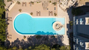Outdoor pool, open 9:00 AM to 10:00 PM, pool umbrellas, sun loungers