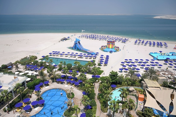 On the beach, beach cabanas, sun-loungers, beach umbrellas