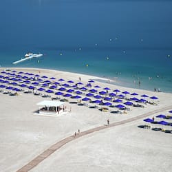 On the beach, beach cabanas, sun loungers, beach umbrellas