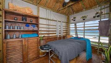 Enjoy a restful stay in this serene room with a comfortable bed, ocean views, and a window.