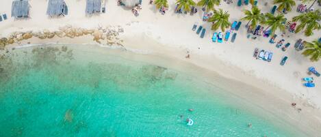 On the beach, sun loungers, beach towels