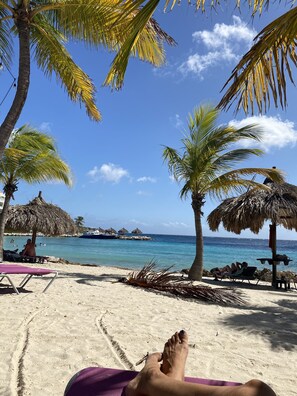 On the beach, sun-loungers, beach towels