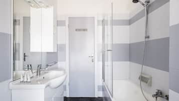 Bathtub, hair dryer, towels, soap