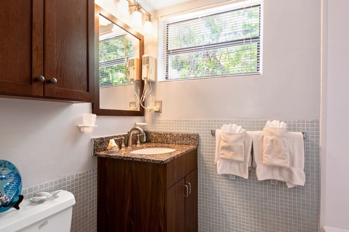 superior studio, pool view | bathroom | rainfall showerhead, hair dryer, towels, soap