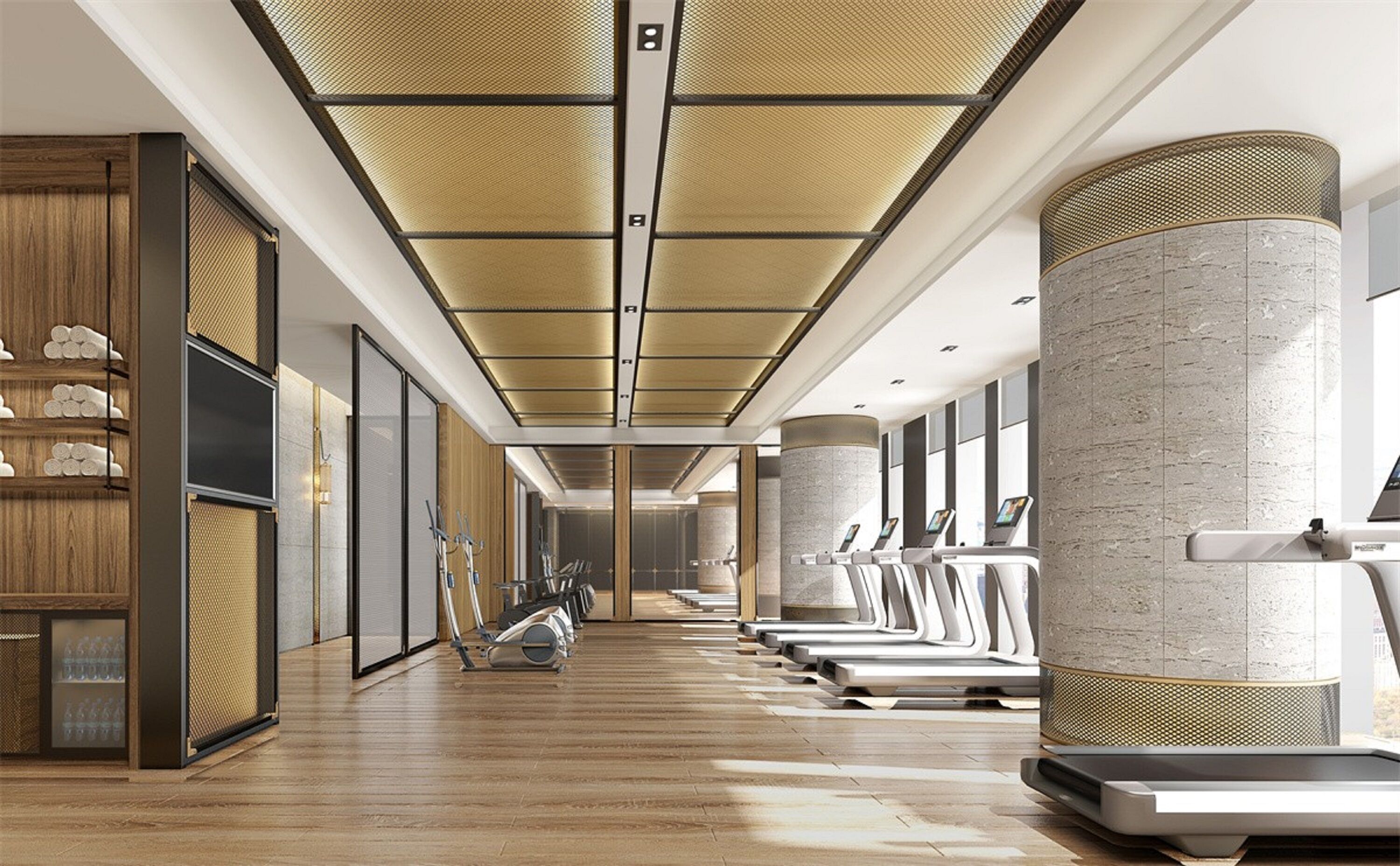 A modern gym with exercise equipment, wooden flooring, and a high ceiling with a patterned design.