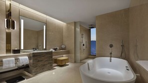Deluxe Room, 1 King Bed | Bathroom | Rainfall showerhead, hair dryer, children's dressing gowns, slippers - Hilton Lanzhou City Center (Lanzhou)