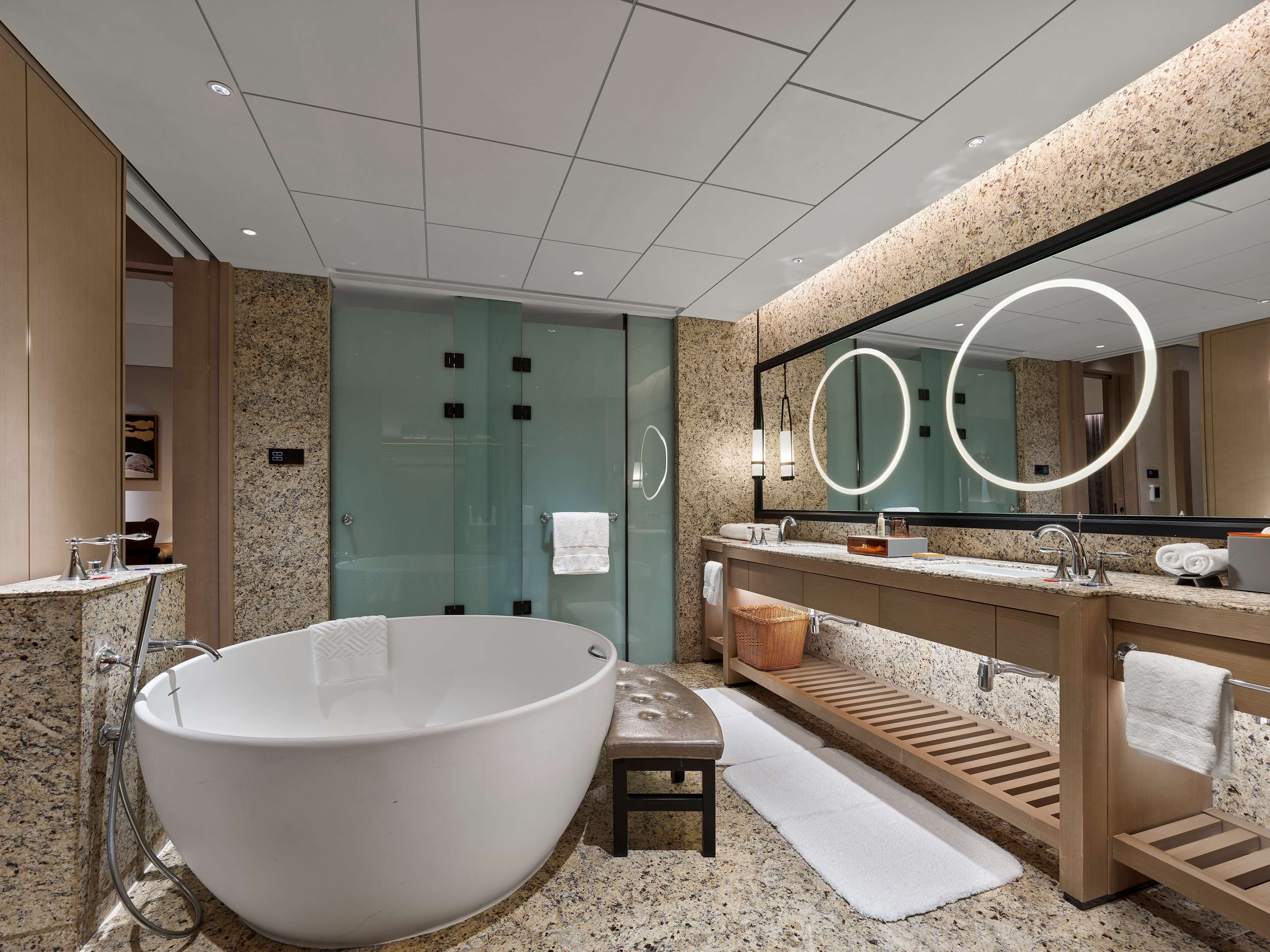 Deluxe Suite, 1 King Bed | Bathroom | Rainfall showerhead, free toiletries, hair dryer, bathrobes