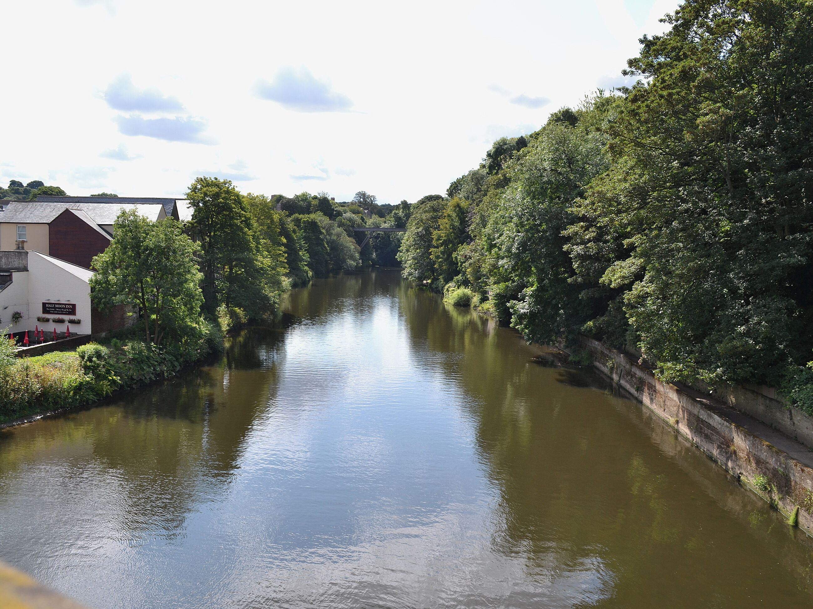 A river with a building named "Half Moon Inn" on the left.