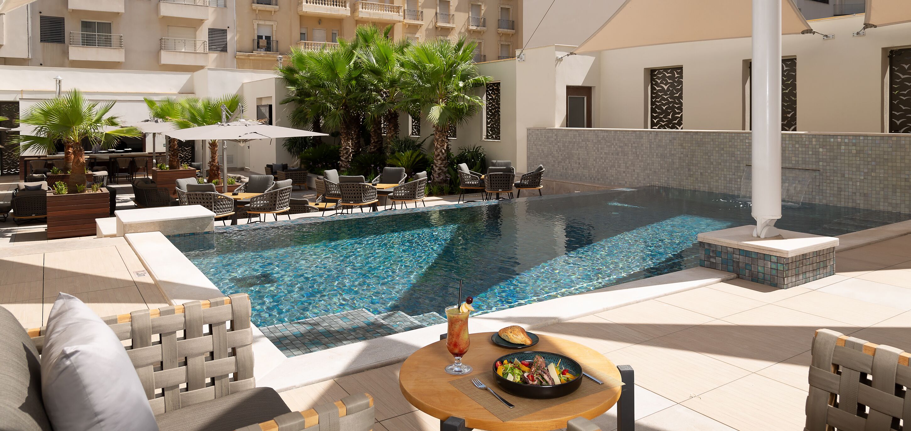 outdoor pool, open 9:00 am to 5:00 pm, pool loungers