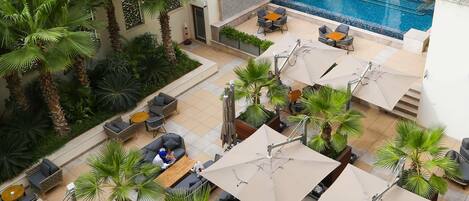 Breakfast, lunch, dinner served; international cuisine, pool views