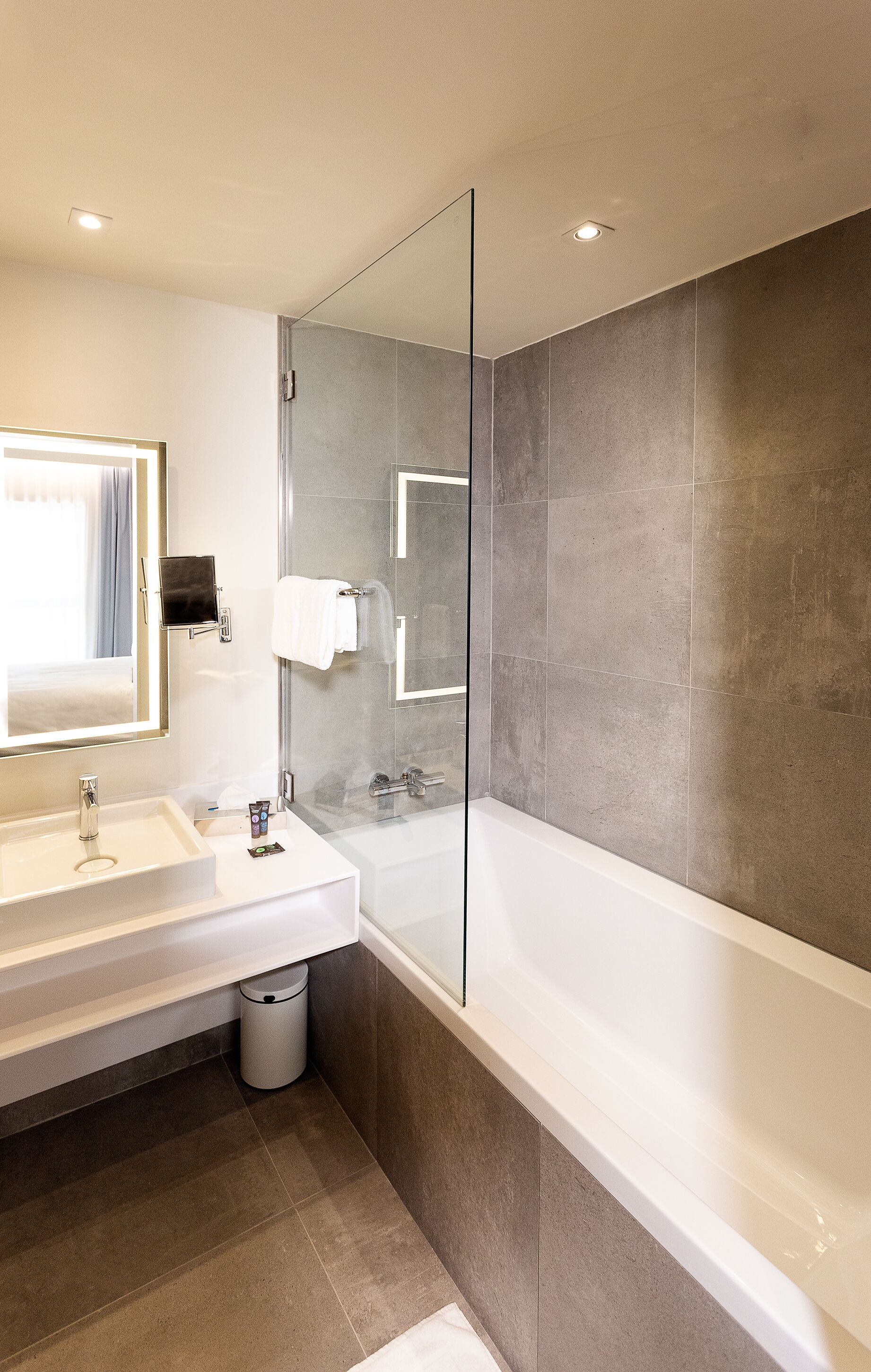 deluxe double room, 1 double bed | bathroom | deep-soaking bathtub, rainfall showerhead, eco-friendly toiletries