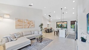 A modern living room with a sofa, coffee table, and artwork on the wall. - * Welcome to Relaxa * (Naples)