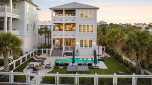 A multi-story house with a pool, outdoor seating, and a fenced yard. - 1 HOUSE OFF BEACH w/ LSV, BIKES, POOL & GULF VIEWS! PET FRIENDLY! (Santa Rosa Beach)
