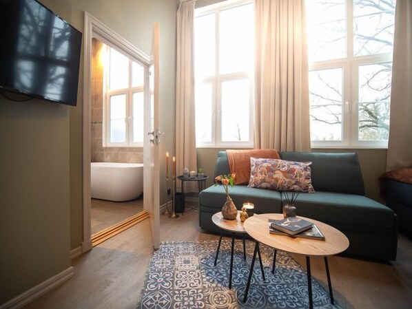 Chambre Triple Premium, plusieurs lits, non-fumeur, vue jardin