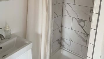 Hair dryer, towels, shampoo, toilet paper
