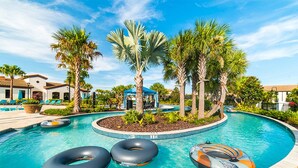 A swimming pool with three inflatable rings, palm trees, and a gazebo. - New Listing! Windsor At Westside Resort, 8mi to Disney & 15mi to Universal - GRH438823 (Kissimmee)