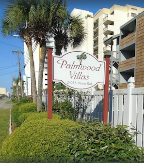 A sign for Palmwood Villas at 2405 S. Ocean Blvd. - Direct Oceanfront Corner Unit Villa, 2BR 2Bath, large pool, million dollar view! (North Myrtle Beach)