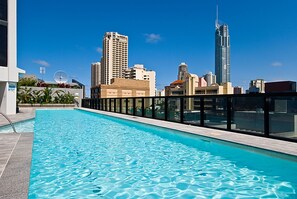 Enjoy a refreshing swim surrounded by stunning city views from our rooftop pool.