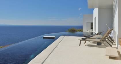 Luxueuse villa avec piscine à débordement et vue mer et coucher de soleil