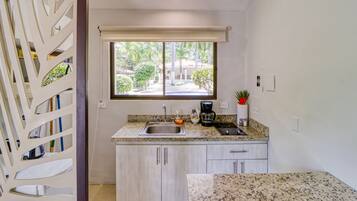 Microwave, stovetop, coffee/tea maker, cookware/dishes/utensils