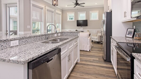 Fridge, microwave, oven, stovetop - Coastal chic beach home in Cottages at Lagoon Pass with EV charger and pool. (Gulf Shores)