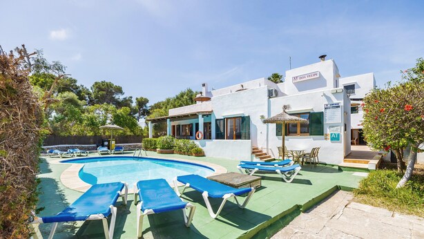 A pool area with lounge chairs, a building with a sign 'AT DON FELIPE,' and a clear sky. - Holiday Apartment "Felipe 2-2" with Terrace & Shared Pool (Tourist Taxes Included) (Cala Dor)
