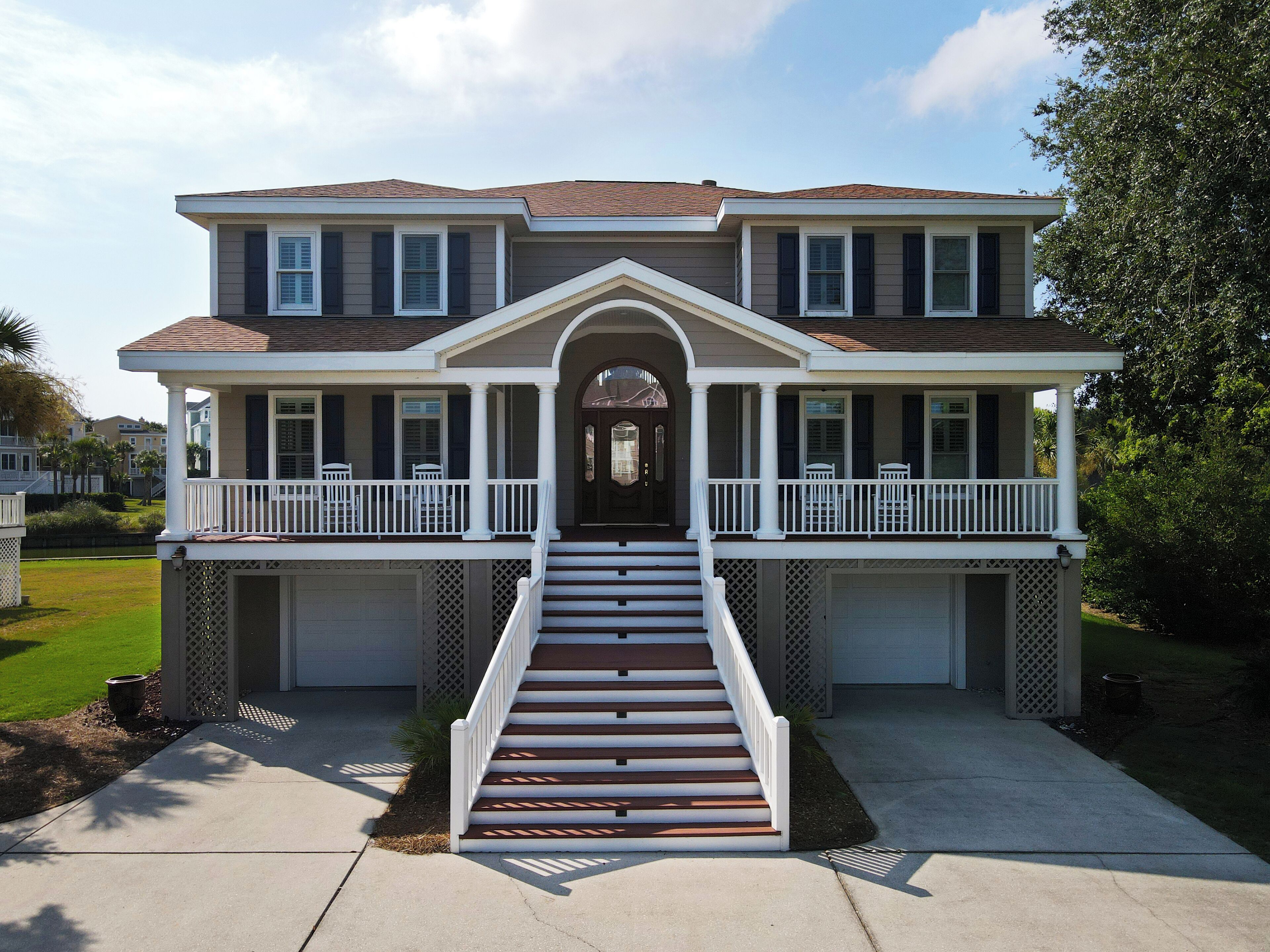 Beautiful home with open porches overlooking lagoon in Wild Dunes