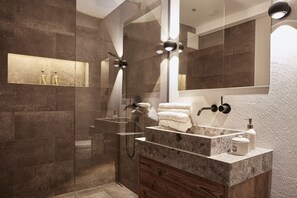 Bathtub, hair dryer, towels, soap